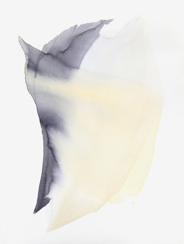 A swooping form created by yellow and charcoal watercolor paint seems to be moving on its white canvas. 