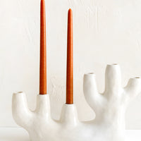 Natural White / Multi [$88.00]: A ceramic candelabra in barnacle-like shape with six openings.