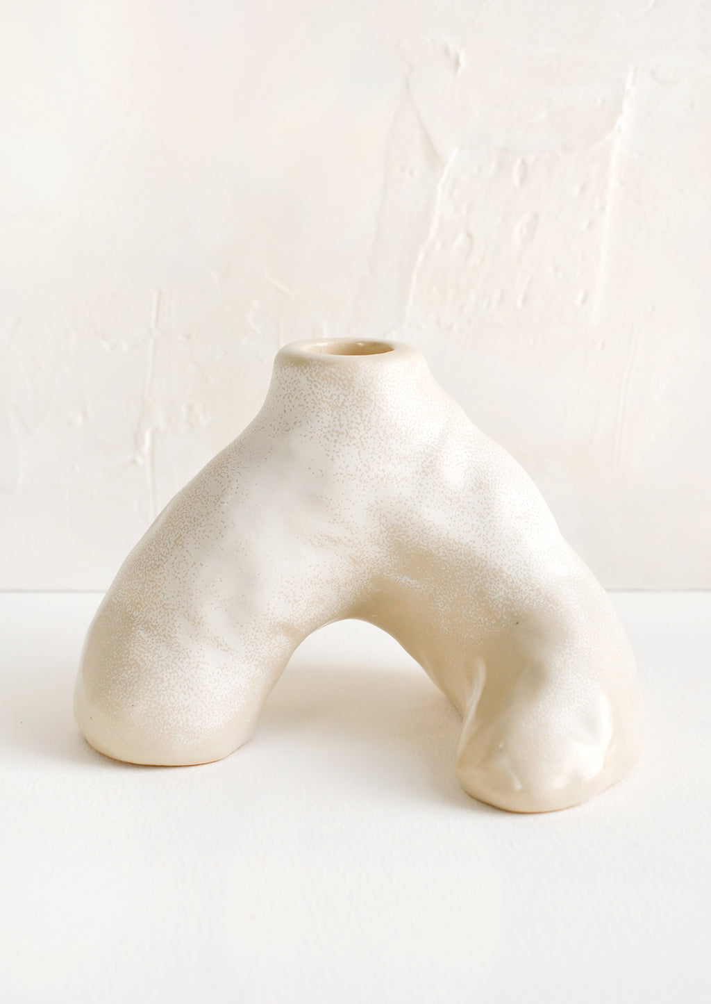 Natural White / Single [$26.00]: A ceramic taper holder in barnacle-like shape.