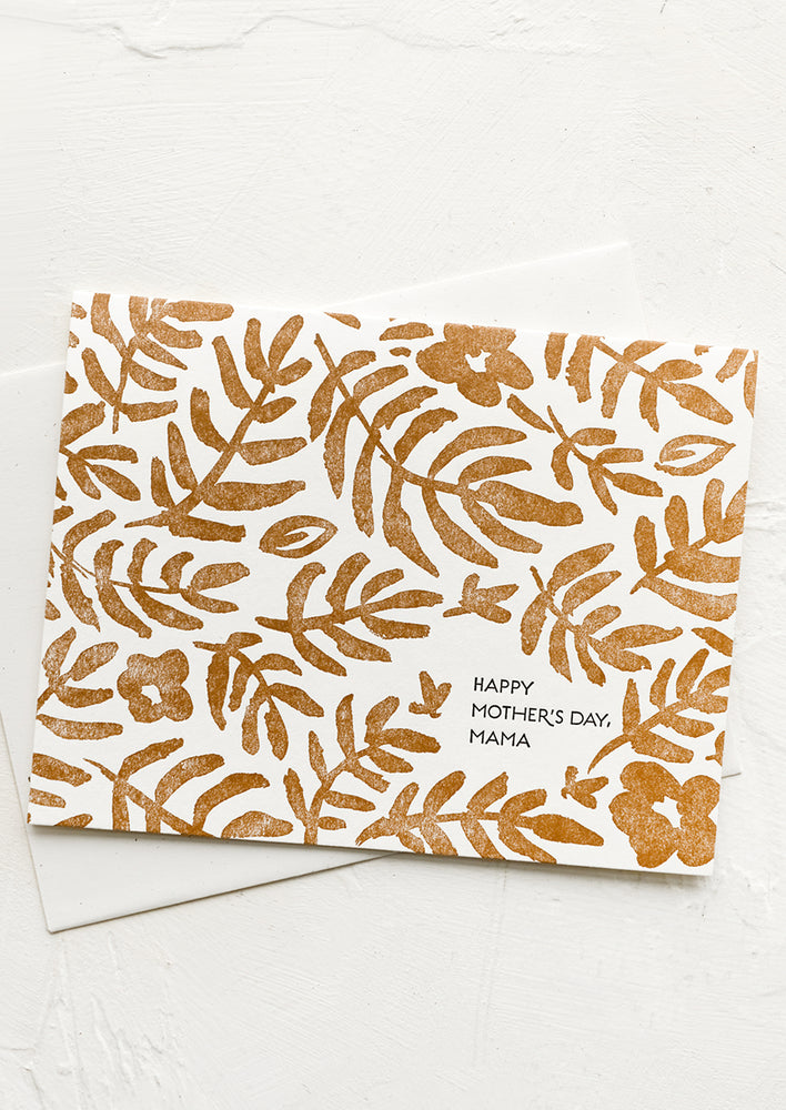 A card with brown floral print reading "Happy mother's day, mama".