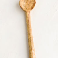 3: A simple carved wooden teaspoon.