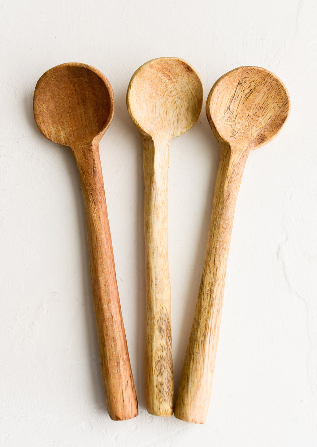 2: Three carved wooden teaspoons in slightly different wood colors.