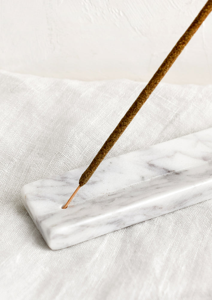 A long solid marble incense burner tray.