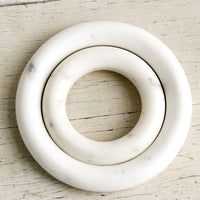 2: Nesting circular marble trivets.