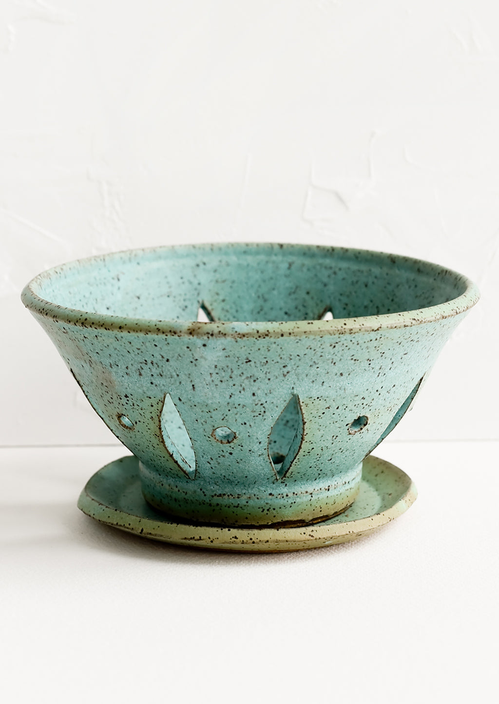 Turquoise Speckle: A ceramic berry bowl with plate in turquoise.