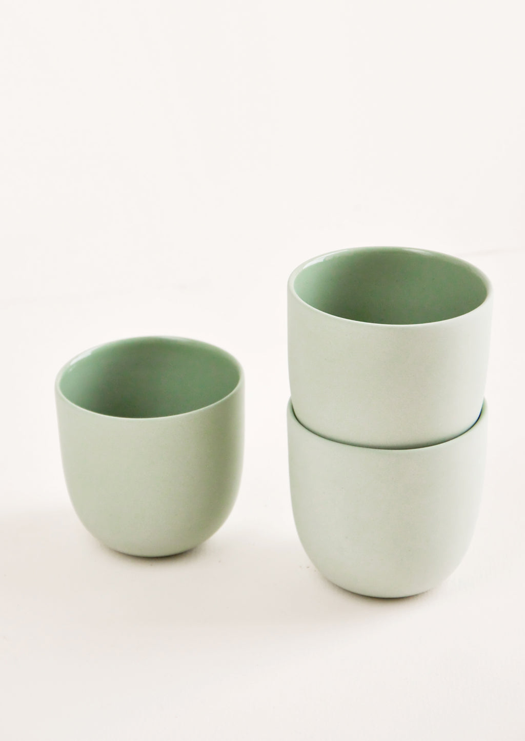 Moss: Three green matte porcelain short tumblers.