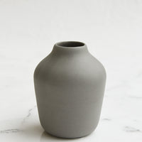 Charcoal: A charcoal colored porcelain bud vase.