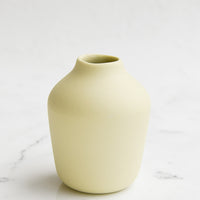 Maize: A pale yellow porcelain bud vase.