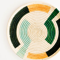 Forest Multi: Geometric Patterned Round Raffia Serving Tray in Forest Multi - LEIF