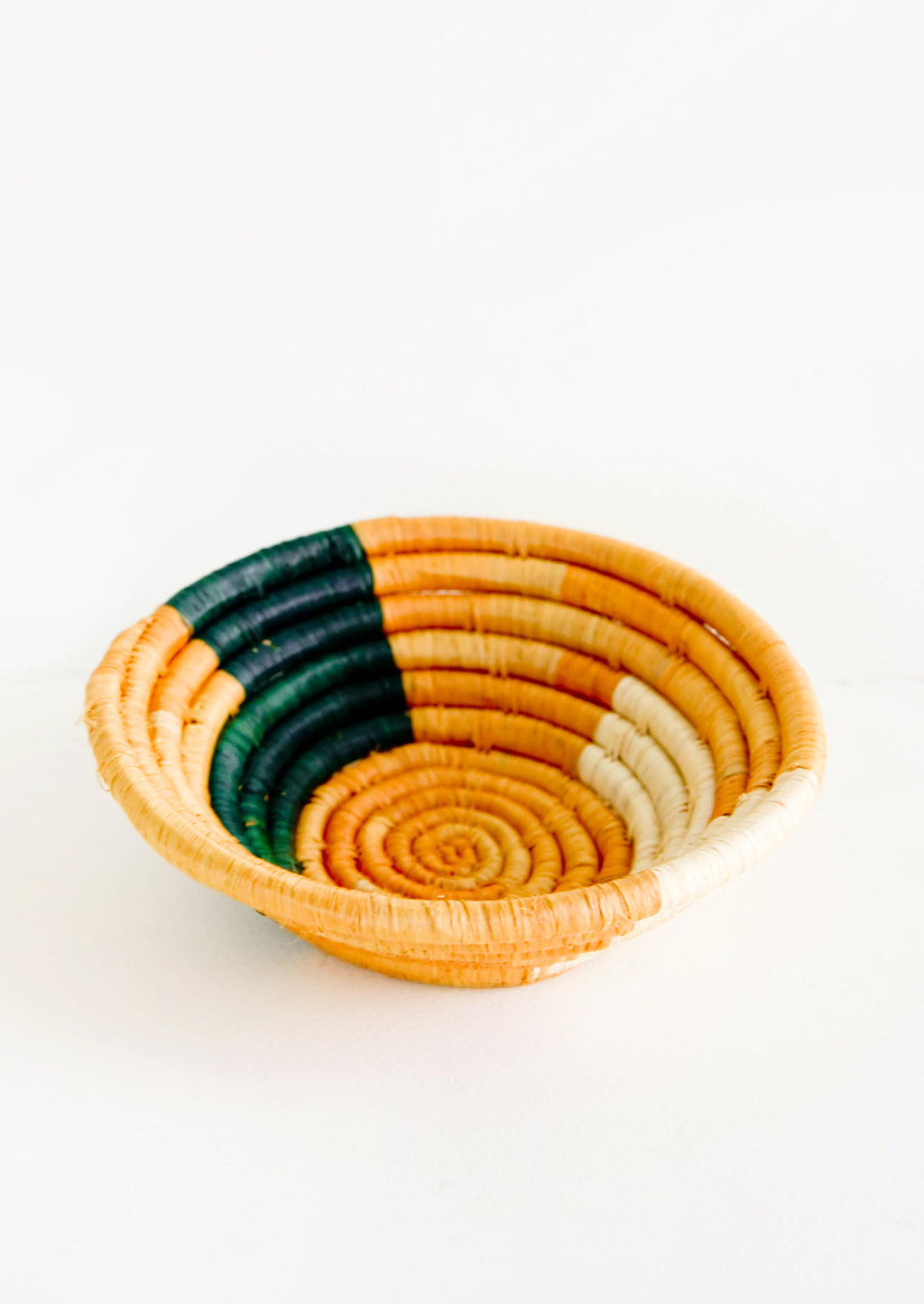 Goldenrod / Indigo Multi: Small raffia bowl in geometric pattern in mustard, green and natural