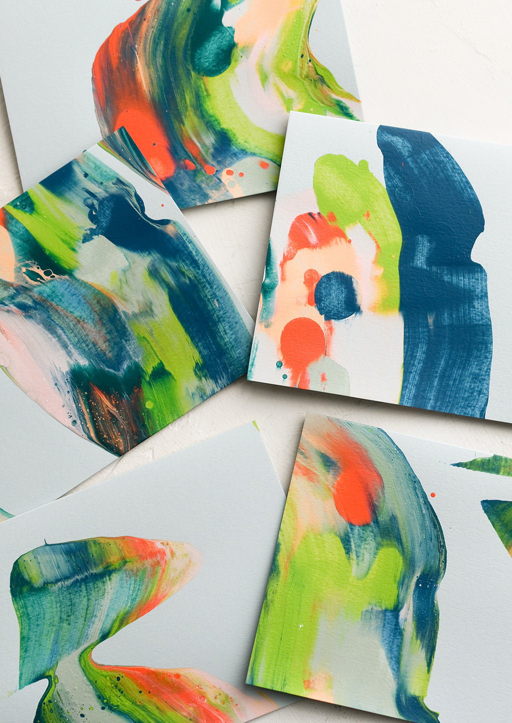 1: Paintswirl cards in shades of blue, coral and green.