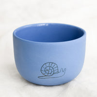 Medium / Snail / Cornflower: A short and wide cornflower blue cup with snail sketch.