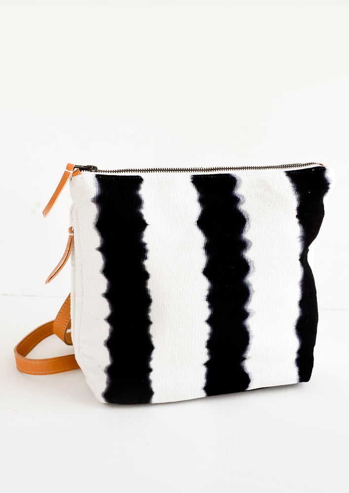 1: Fashion backpack made from cotton canvas in black & white tie dye stripes with tan leather accents