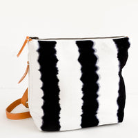1: Fashion backpack made from cotton canvas in black & white tie dye stripes with tan leather accents
