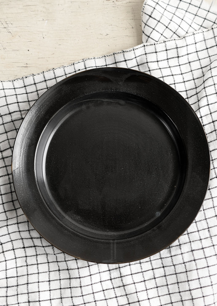 A black ceramic pasta plate/bowl.