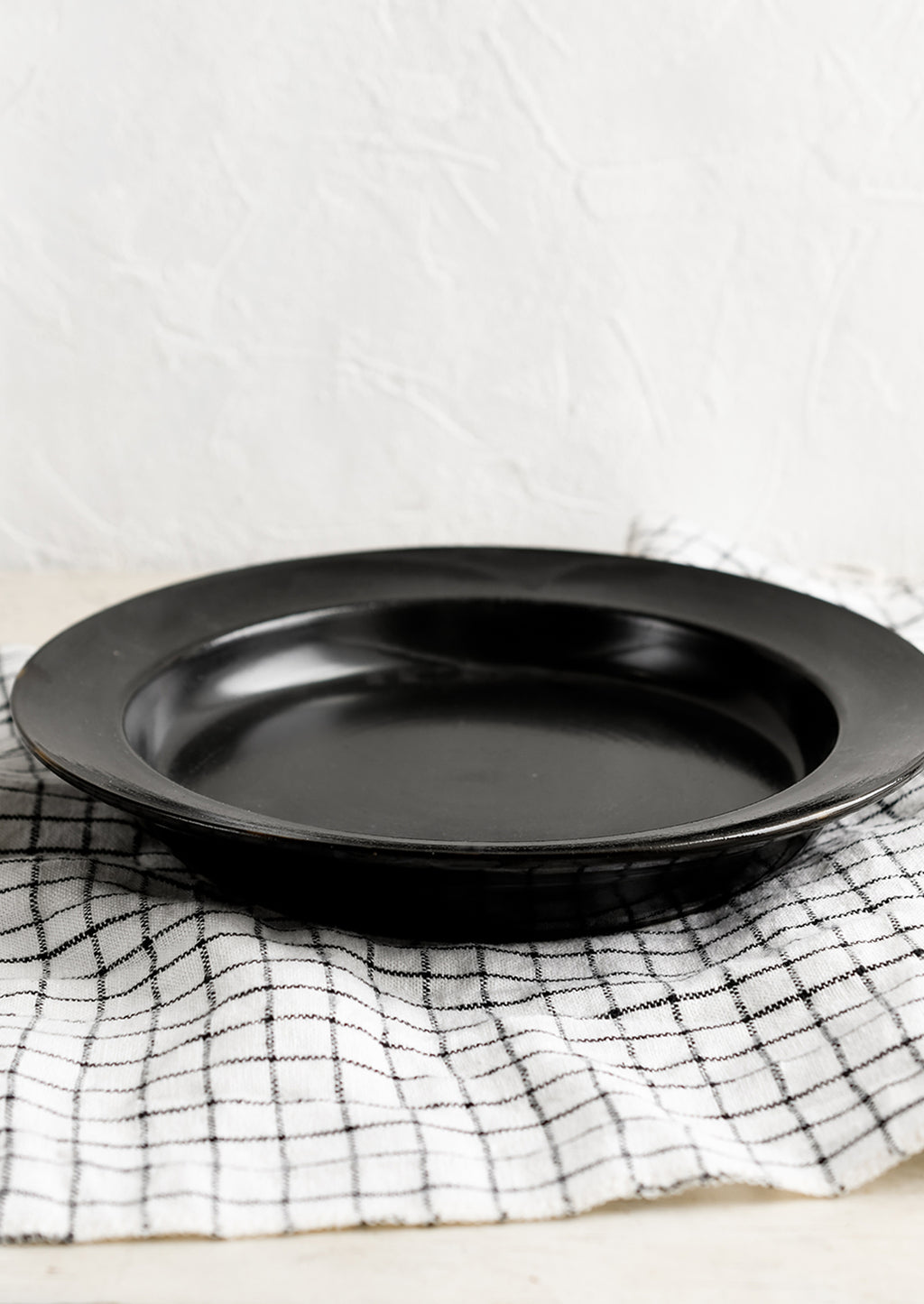 2: A black ceramic pasta plate/bowl.