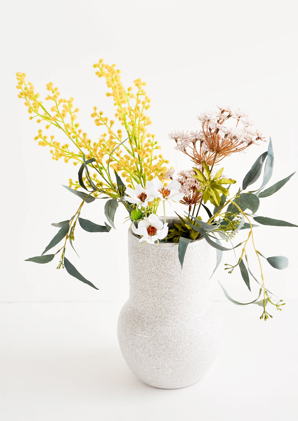 Tall [$60.00]: Tall ceramic vase in textured light grey glaze, pictured with floral bouquet