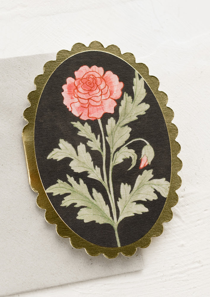 1: A small oval shaped card with scalloped edges and rose drawing.