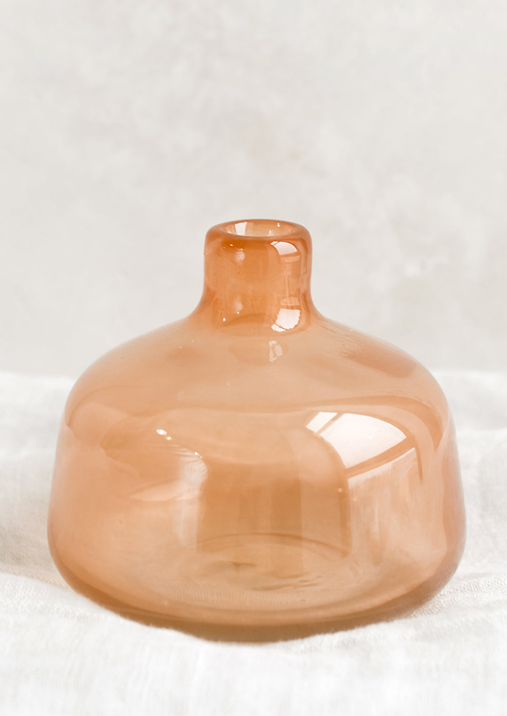 2: A peach glass bud vase.