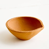 1: Tiny bowl in terracotta clay with line textured rim and spouted shape