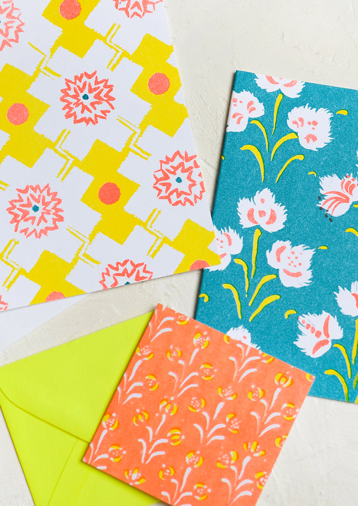 Teal / Neon Peach: A patterned risograph printed card set in yellow, teal and orange.