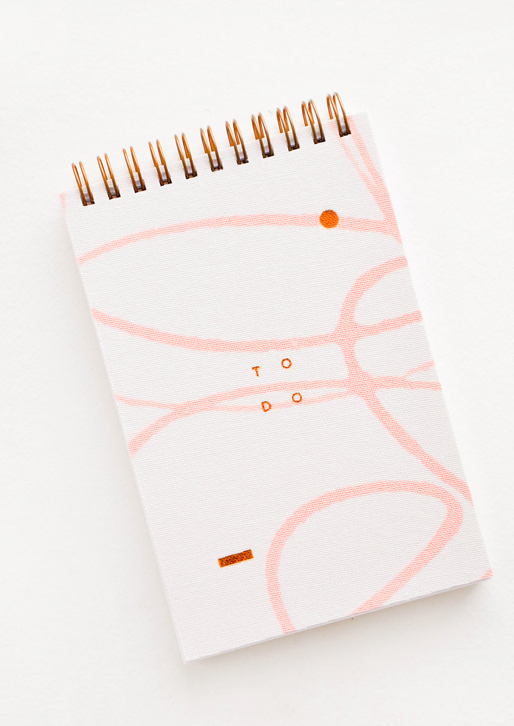 1: Spiral bound notepad with abstract line decoration and the text "TO DO".