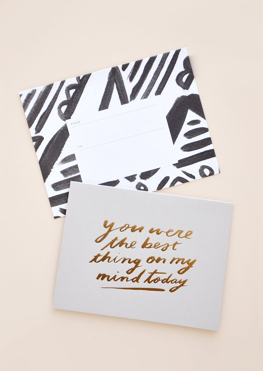 2: Grey greeting card with "You were the best thing on my mind today" in gold foil. Shown with black and white patterned envelope.