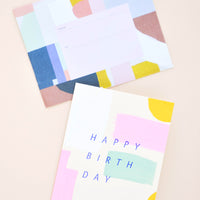 2: Greeting card with hand-painted colorful brushstrokes and "Happy Birthday" printed in cobalt blue