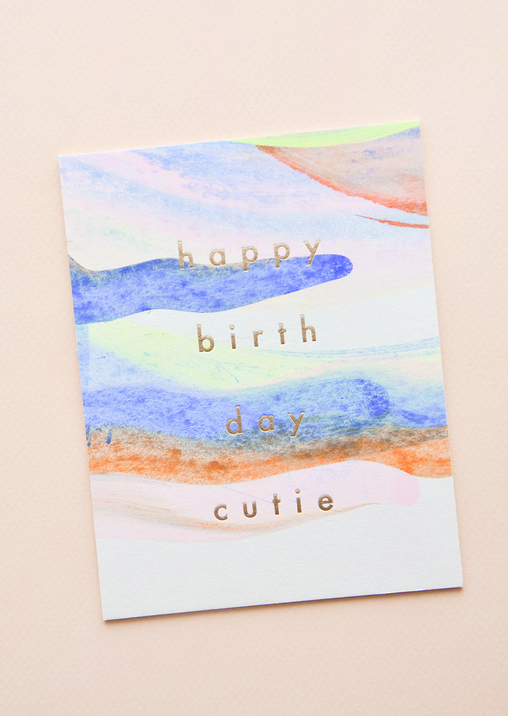 1: Notecard with pastel washed paint strokes and the text "Happy Birthday Cutie" in gold metallic.