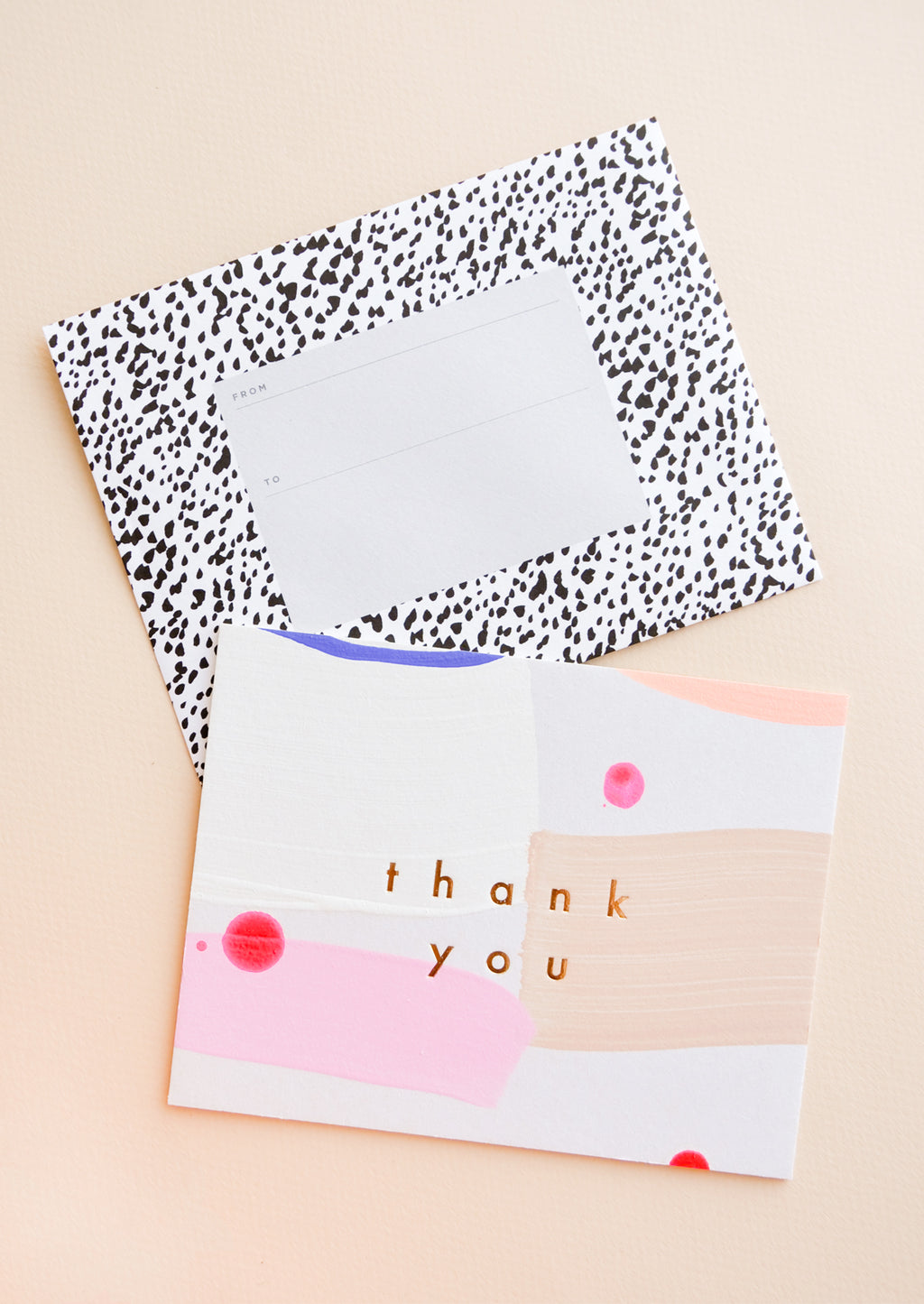 2: Hand painted card in colorful abstract pattern with gold foil "Thank you" text, paired with black and white printed envelope