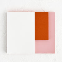 Rose / Terracotta / White: A landscape oriented notepad with three separate sized sections in different colors.