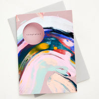 1: Greeting card with multicolor paint streak, circular cutout on front to reveal interior text