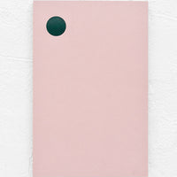 1: A pink notepad with green dot at top left corner.