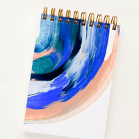 Notepad (Unruled): Pocket-size spiral bound notebook with handpainted cover in blue and peach paint swirl