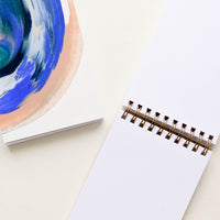 3: Spiral bound notebook with painted cover and blank unruled pages