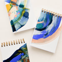 1: Small, pocket-size spiral notepads with covers painted in earth toned paint swirls