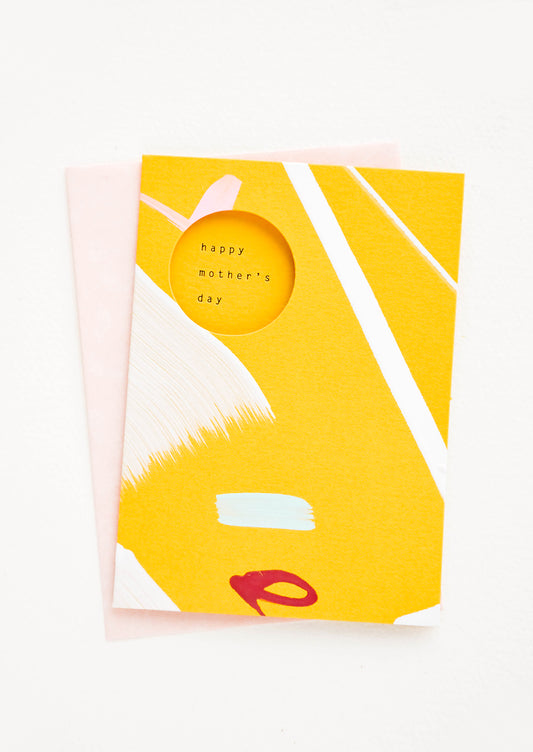 Yellow greeting card with hand-painted shapes and cutout window revealing "Happy Mother's Day" text