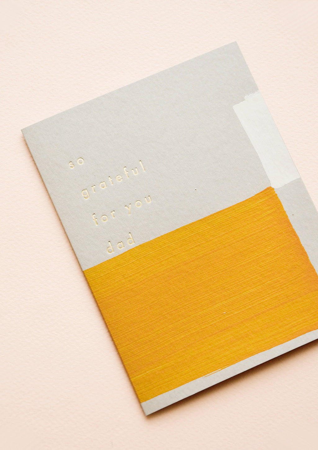 2: Greeting card with hand-painted square shapes in mustard and white, gold text reads "So grateful for you dad"