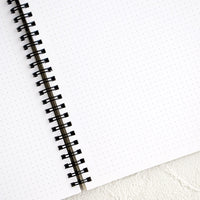 2: Interior pages of spiral bound sketchbook with dot grid printed pages