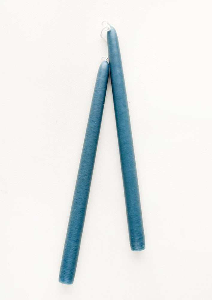 A pair of taper candles in lake blue.