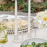 Shell White: Taper candles on a tabletop scene.