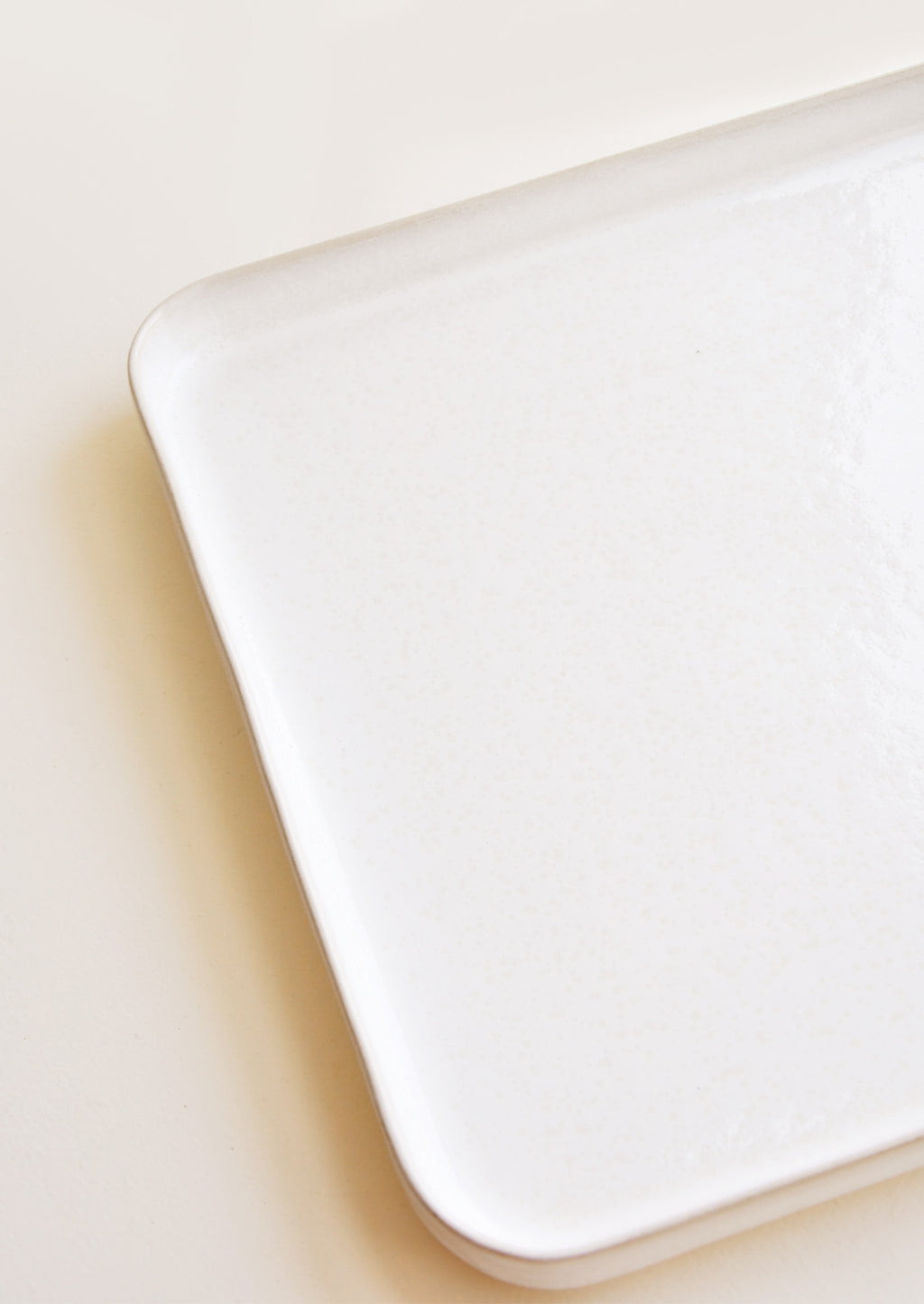 2: Detail of Square Ceramic Tray with Lipped Edge in Ivory.