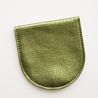 Metallic Olive: A metallic green leather half-oval wallet with a subtle geometric pattern.