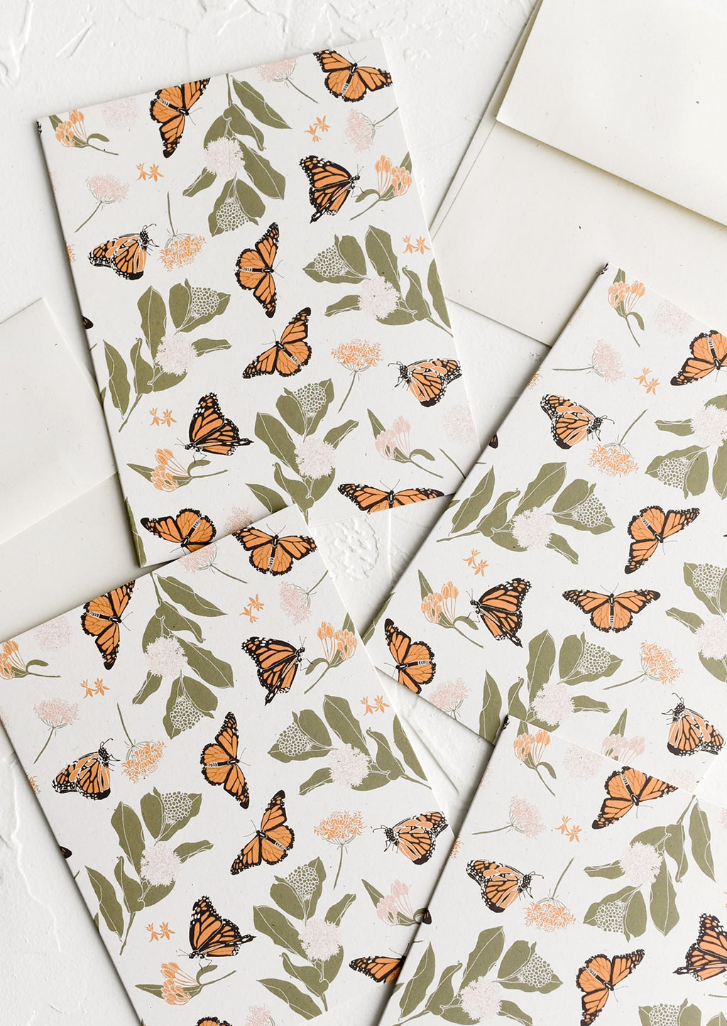 Boxed Set of 8: Greeting cards with monarch and milkweed print.