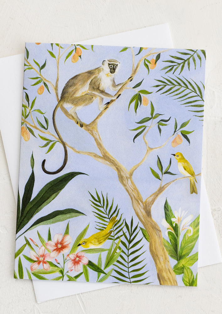 A card with illustration of monkey in tropical trees.