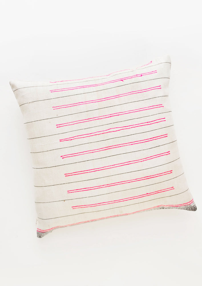 1: Square throw pillow in white fabric with thin black lines and striped hot pink embroidery