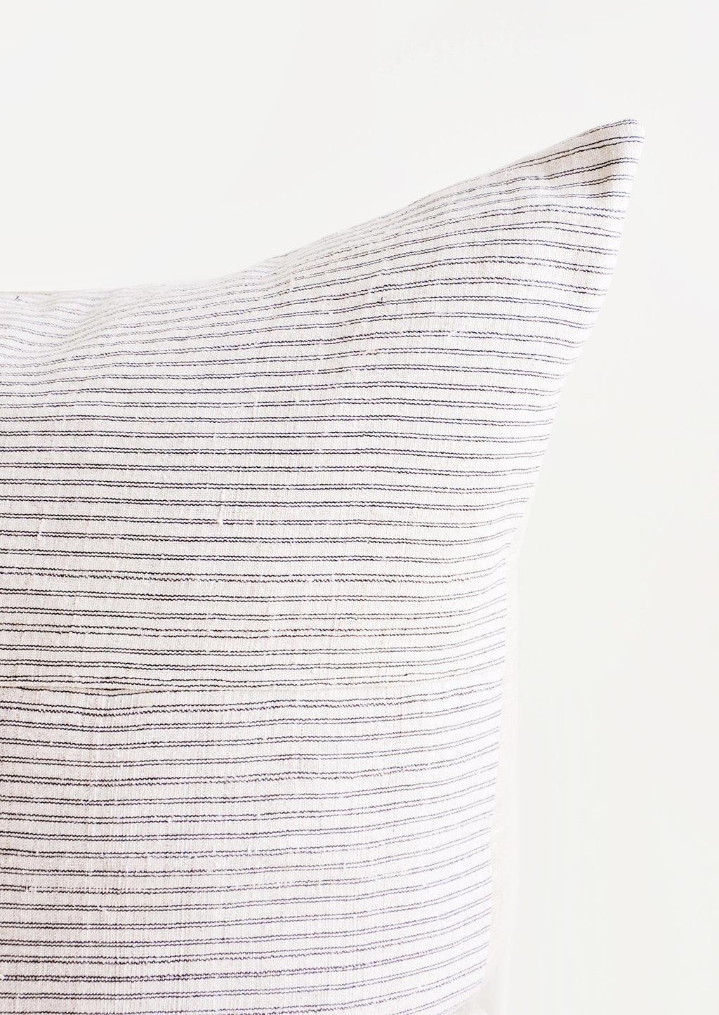 2: Square throw pillow in white hemp fabric with allover thin black stripes