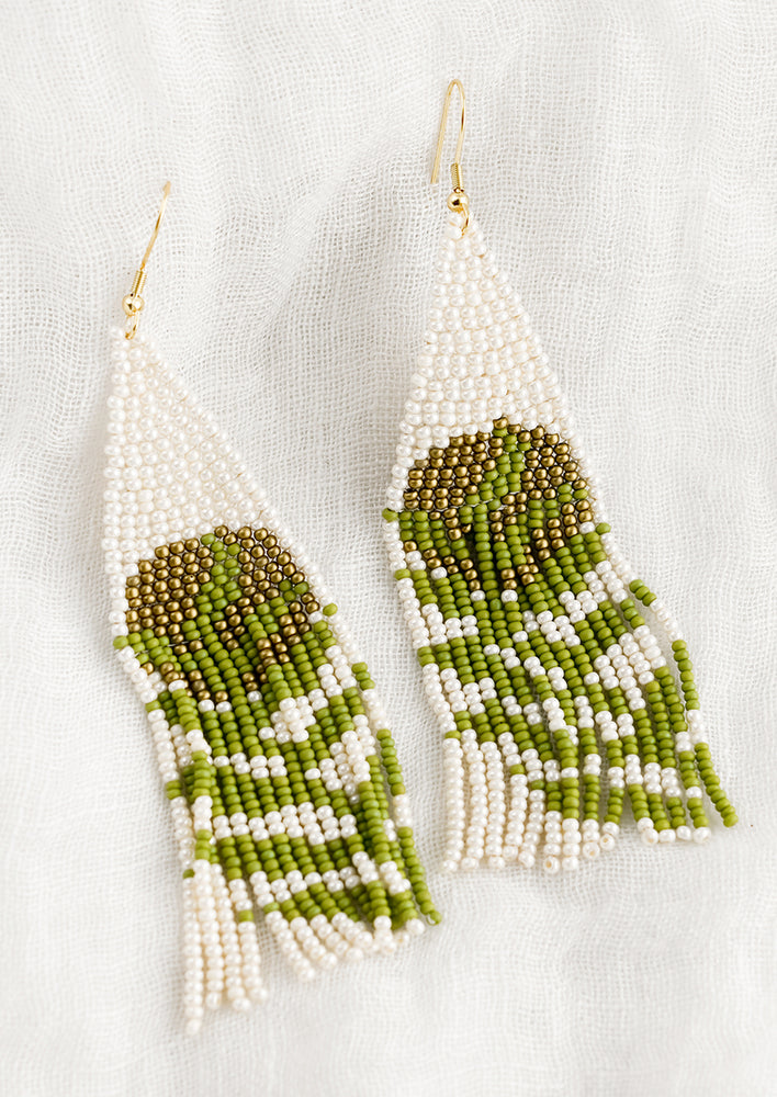 Beaded earrings with leaf pattern and gold moon.