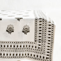 1: Folded cotton tablecloth in white with block printed Indian floral pattern