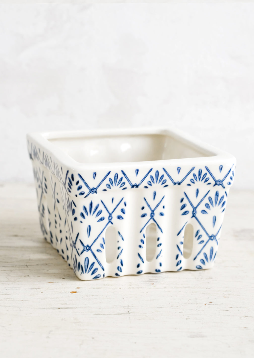 Blue Tilework: A ceramic berry basket with blue tilework print on white ceramic.